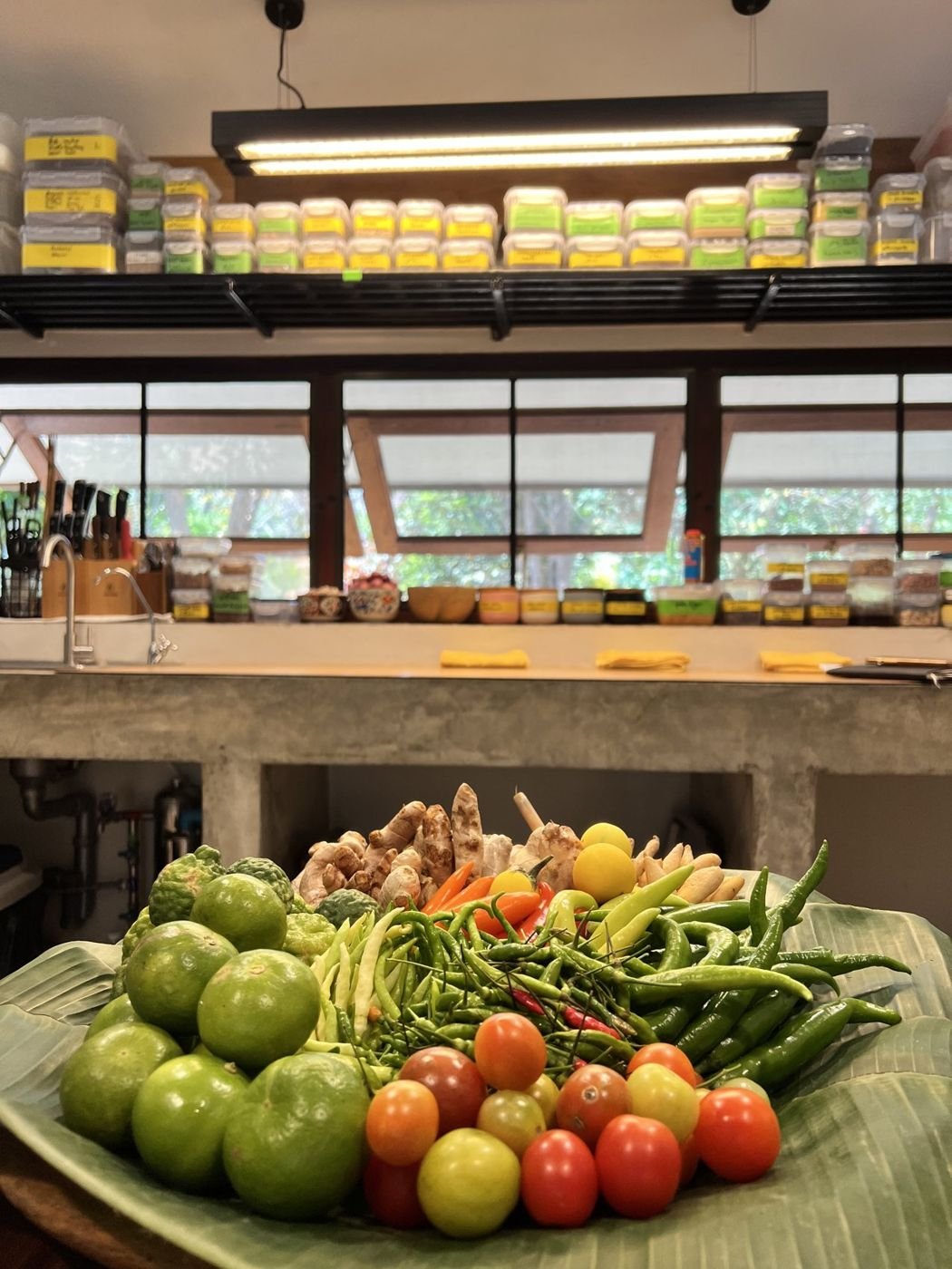 A Thai teaching kitchen, shelves of labeled jars