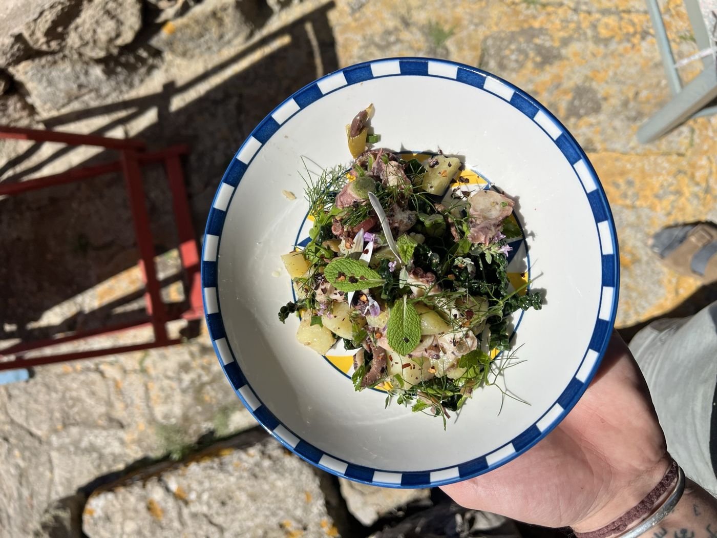 A plate over sun struck stone